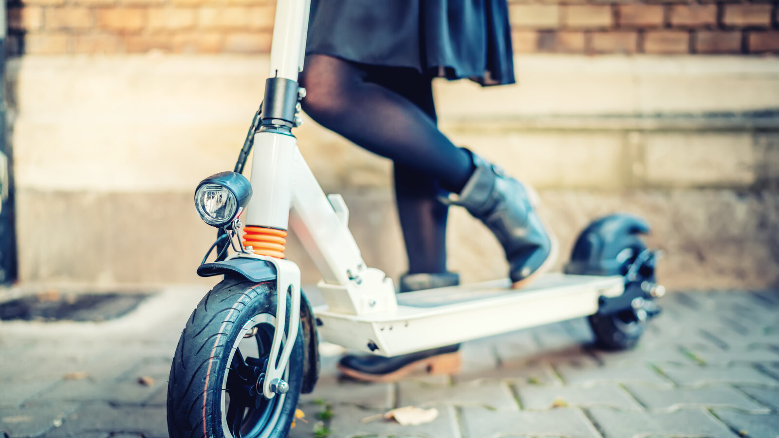 Close-up detail of an electric scooter's motor and wheel